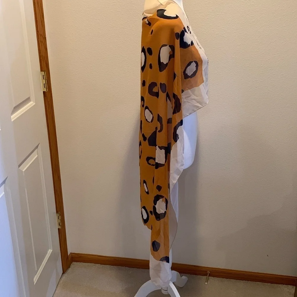 3.1 Phillip Lim Womens Silk multi use scarf. Kind of a burnt orange animal print